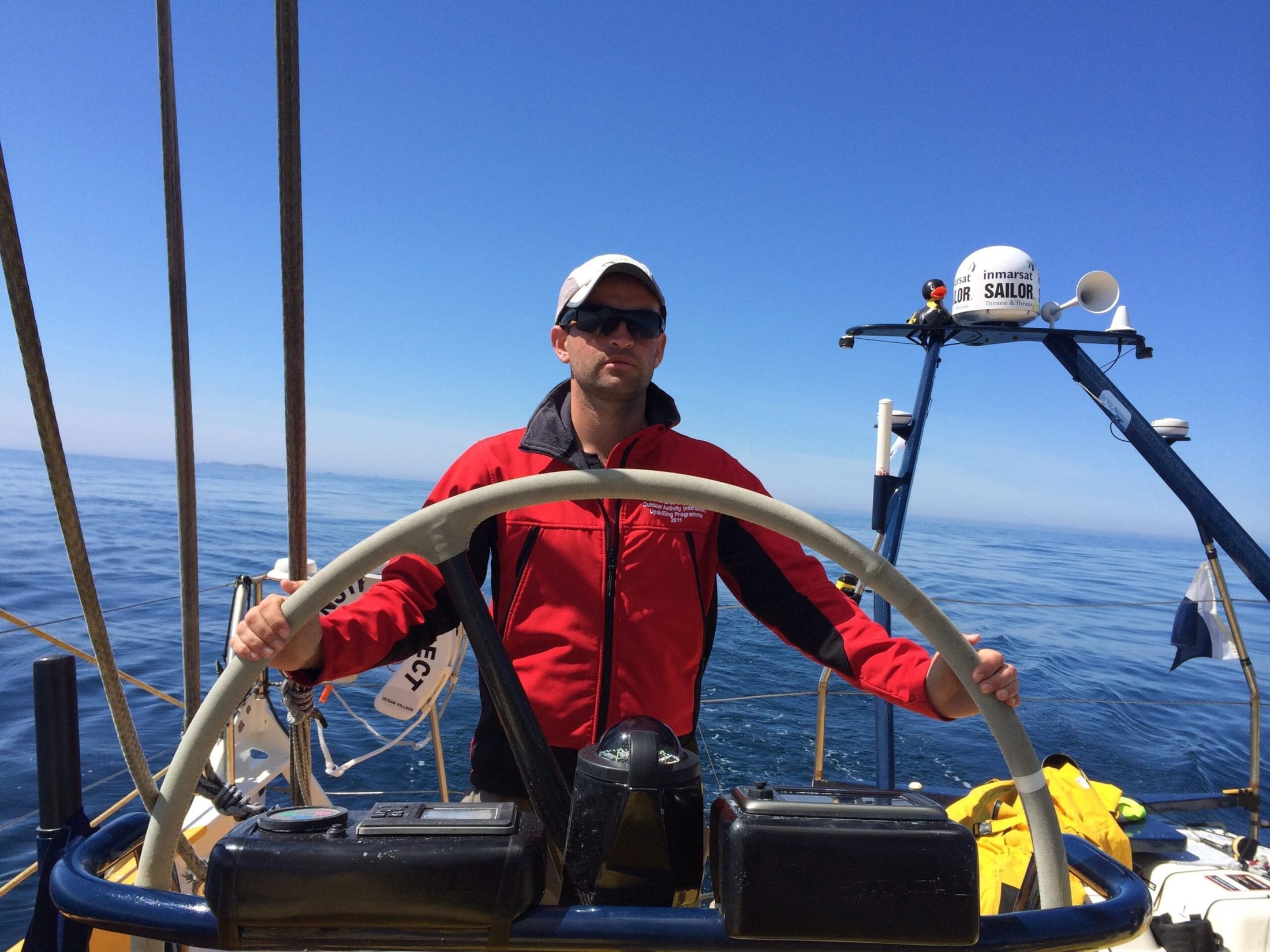 Mike Jones at the helm of a sailing boat
