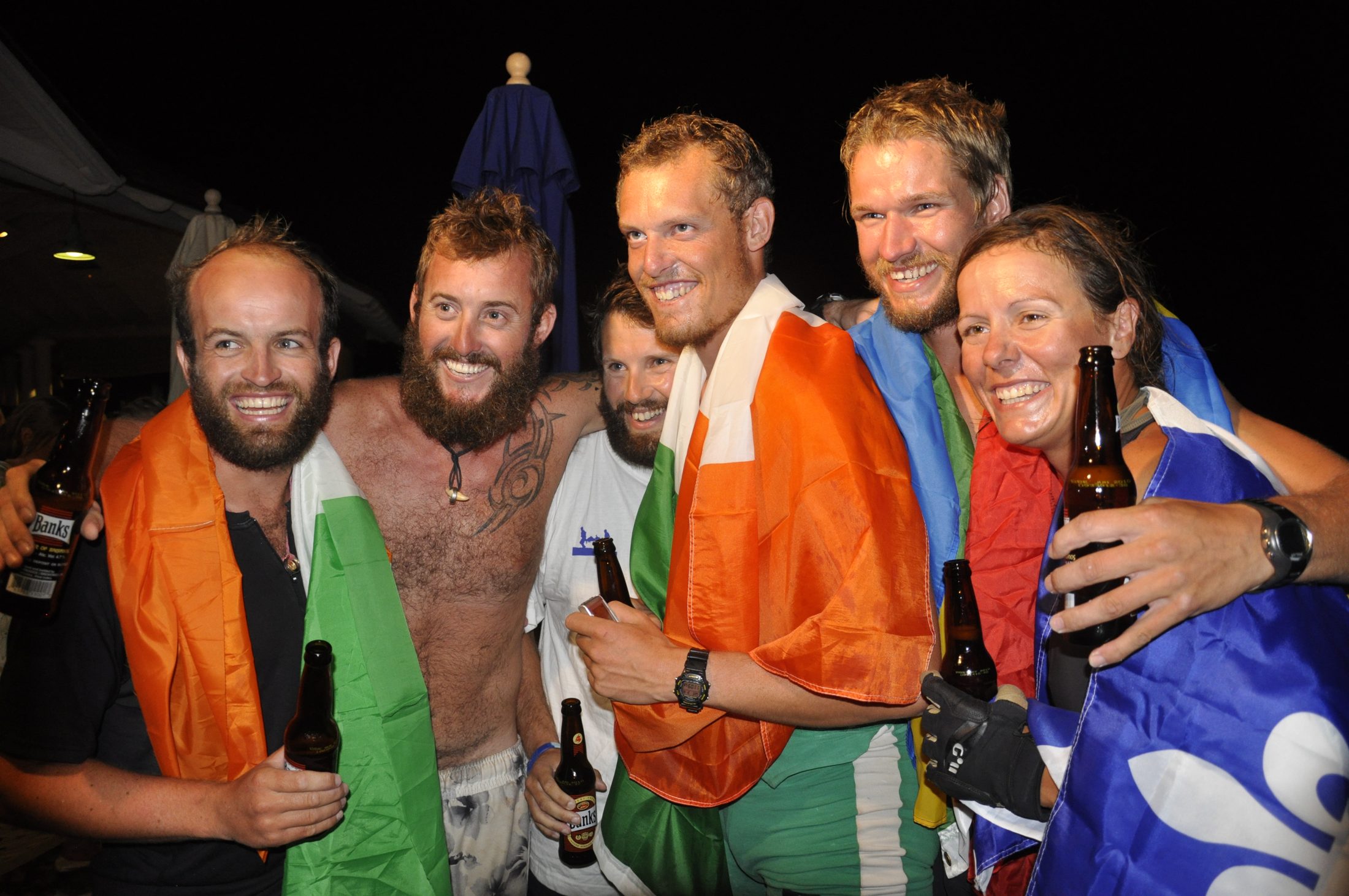 Mike Jones and the crew celebrating at the Atlantic crossing finish line